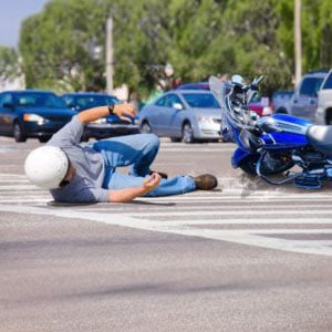 A person falling on the road with a motorcycle - Levian Law