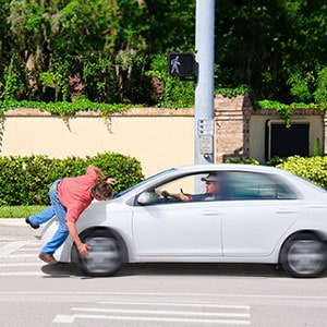 A person falling off a car - Levian Law