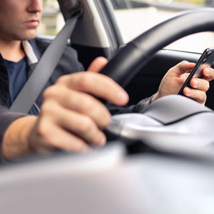 Driver texting while driving: Legal steps for Uber and Lyft accident compensation in California.