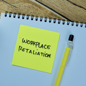 Notebook with Workplace Retaliation note, highlighting LGBT workers' rights protections.