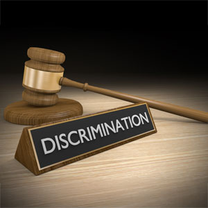 Gavel and discrimination sign representing LGBT employment discrimination lawsuit in California